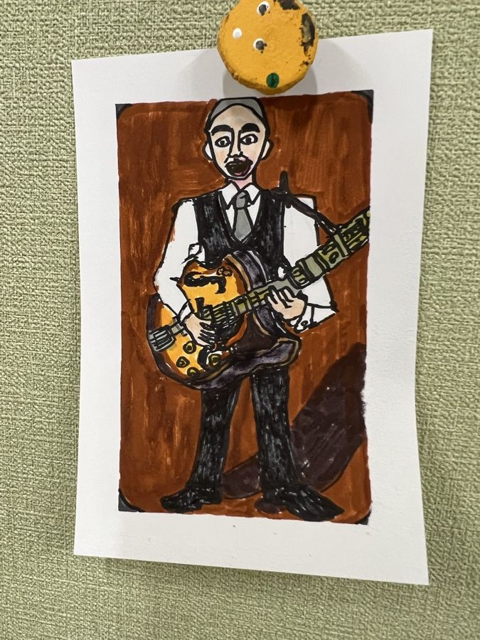 ギターを構える人物の絵
